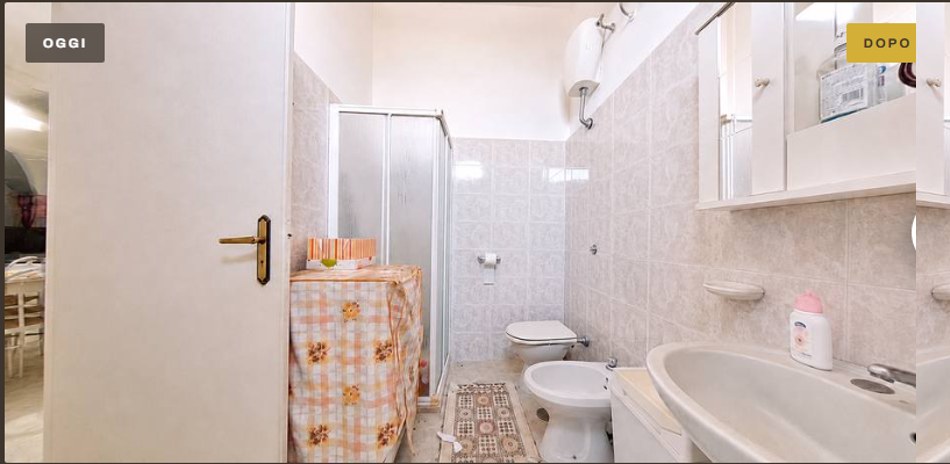 The bathroom today: marbled tiles, aluminium shower enclosure, exposed water heater